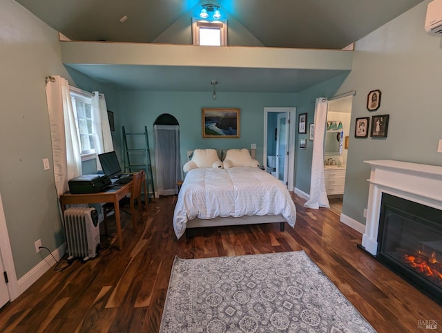 11900 Hwy 116, Guerneville, CA 95446 - bedroom featuring baseboards, radiator, a glass covered fireplace, and wood finished floors