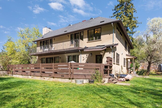 11900 Hwy 116, Guerneville, CA 95446 - back of house with a chimney, fence, a balcony, a yard, and stucco siding