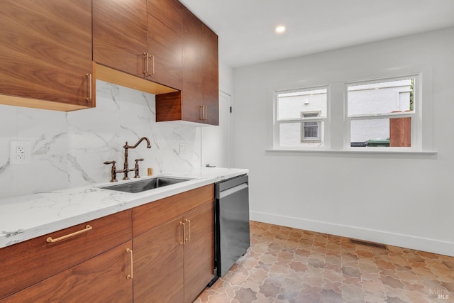 kitchen featuring a sink, tasteful backsplash, dishwasher, baseboards, and visible vents