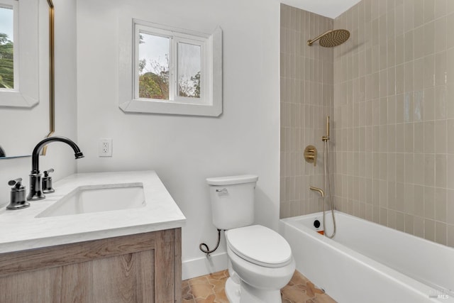 full bathroom with baseboards, toilet, shower / bath combination, and vanity