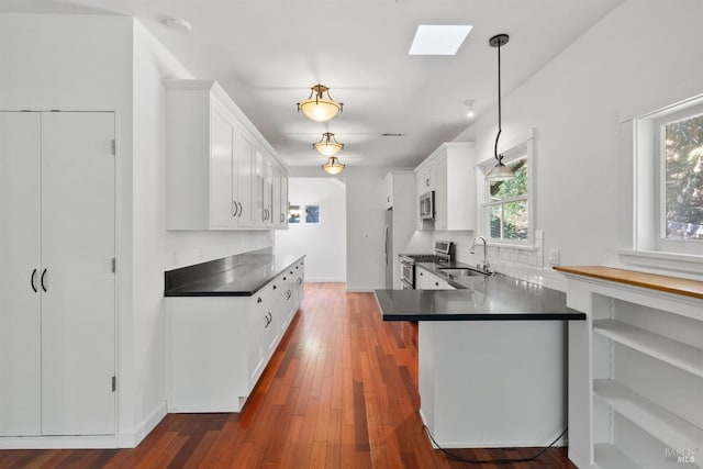 162 Wolfe Grade, Kentfield, CA 94904 - kitchen with a sink, stainless steel appliances, dark countertops, white cabinets, and decorative backsplash