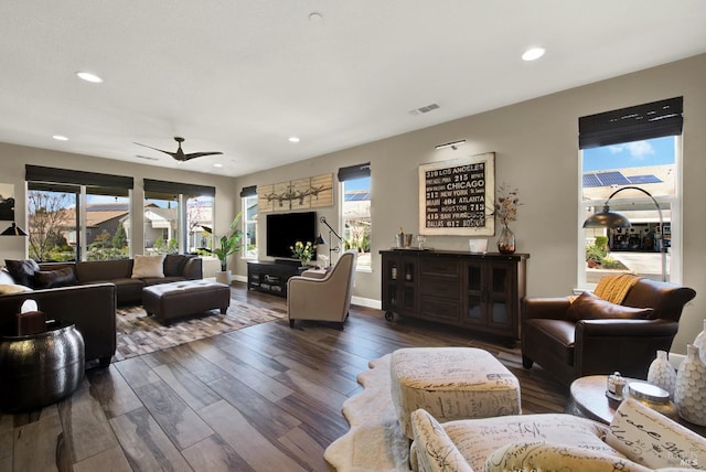 living area featuring visible vents, a ceiling fan, wood finished floors, and recessed lighting