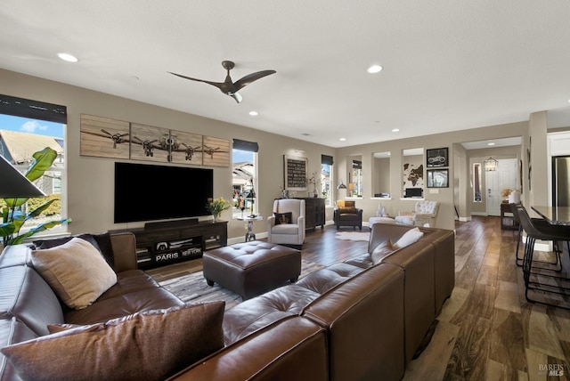 living room with ceiling fan, wood finished floors, and recessed lighting