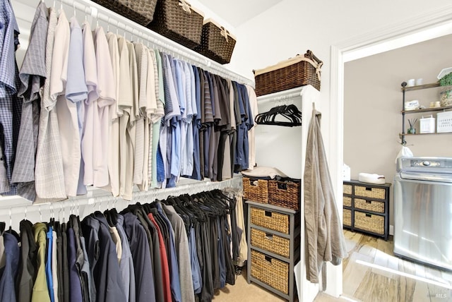 spacious closet featuring washer / clothes dryer
