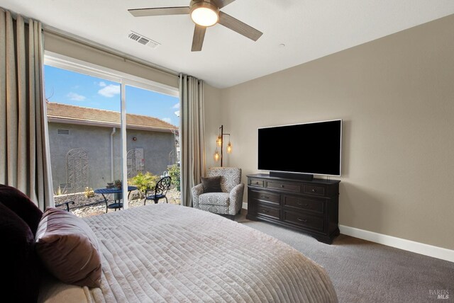 carpeted bedroom with access to exterior, baseboards, ceiling fan, and visible vents