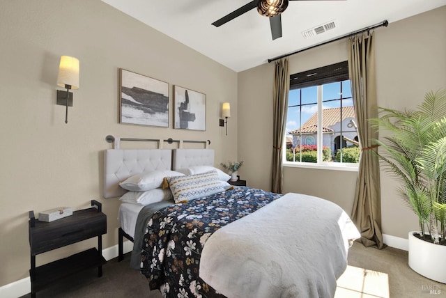 carpeted bedroom with ceiling fan, baseboards, and visible vents