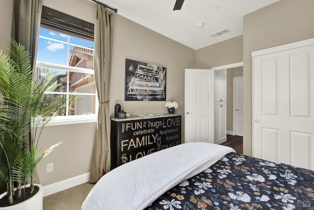 bedroom with ceiling fan, baseboards, lofted ceiling, carpet flooring, and visible vents