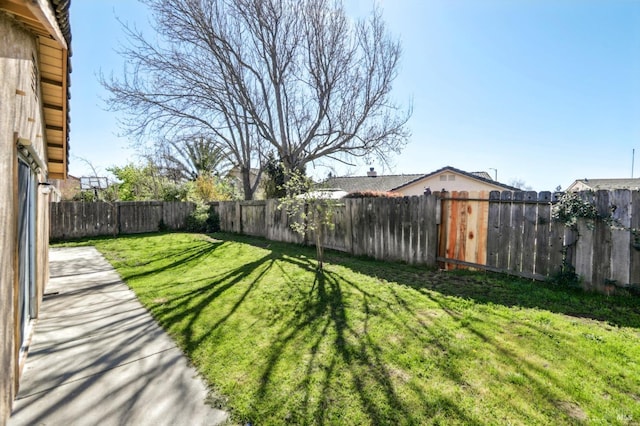 view of yard with a fenced backyard
