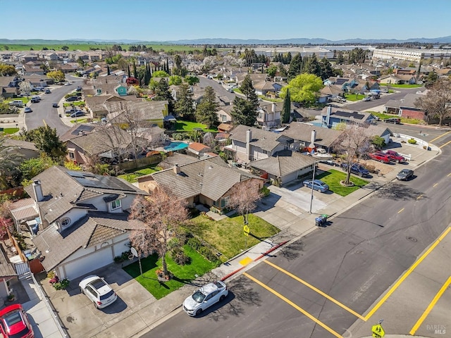 birds eye view of property with a residential view and a mountain view