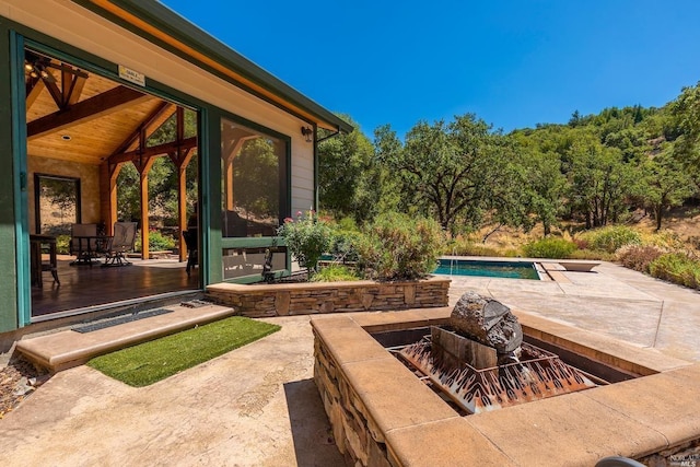 view of patio with an outdoor pool