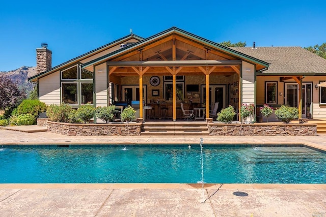 outdoor pool with a patio