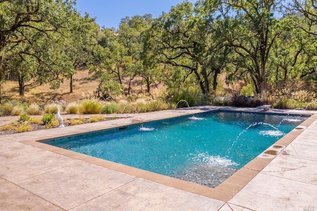 outdoor pool featuring a patio area