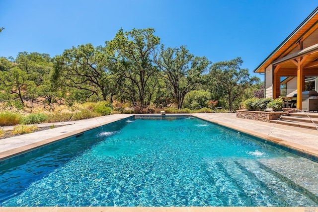 outdoor pool featuring a patio area