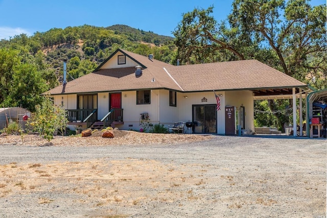 single story home featuring driveway, a mountain view, and crawl space