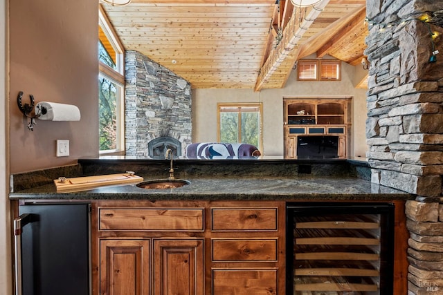 bar featuring wet bar, wooden ceiling, a sink, beverage cooler, and vaulted ceiling with beams
