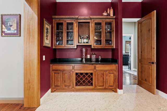 bar with baseboards and a bar