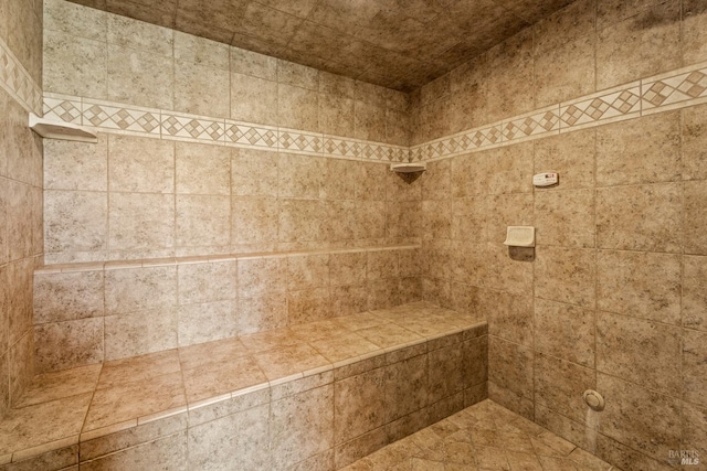 interior space featuring tiled shower