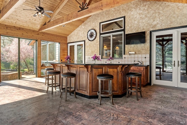 bar featuring high vaulted ceiling, beam ceiling, french doors, wood ceiling, and bar