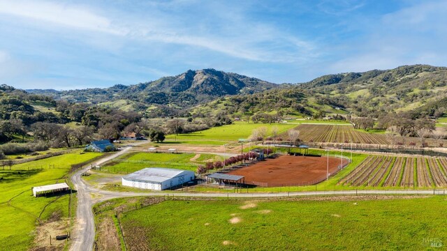 drone / aerial view with a mountain view and a rural view