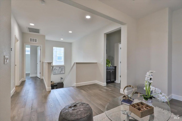 entrance foyer featuring baseboards, visible vents, wood finished floors, and recessed lighting