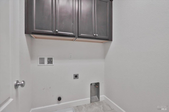 washroom with washer hookup, cabinet space, baseboards, and electric dryer hookup