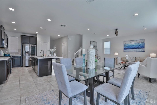 dining room with stairs, visible vents, and recessed lighting