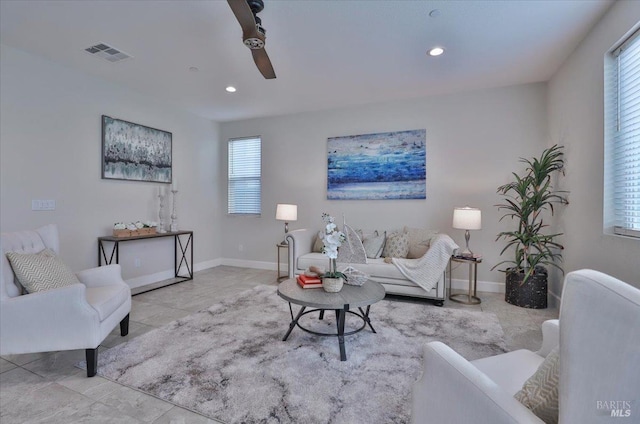 living area with recessed lighting, baseboards, ceiling fan, and visible vents