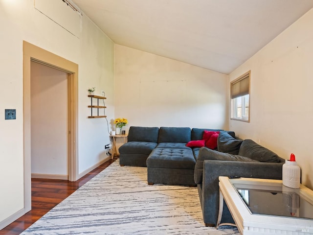 living room featuring dark wood-style flooring, baseboards, and lofted ceiling