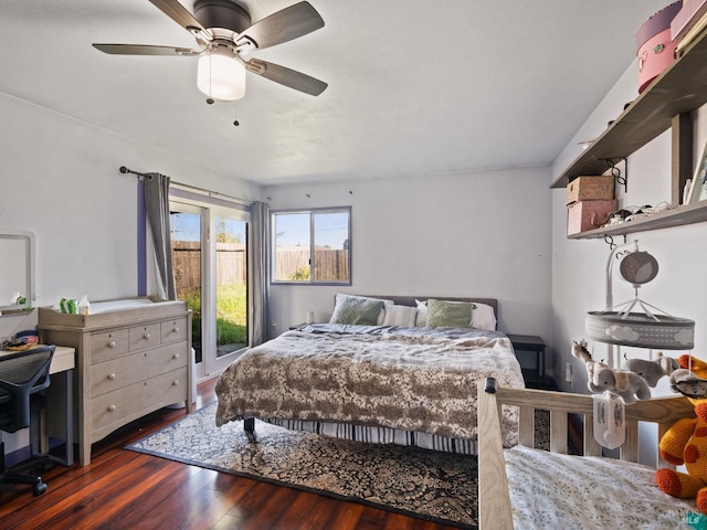 bedroom featuring access to exterior, ceiling fan, and hardwood / wood-style flooring