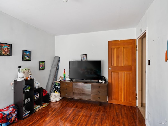 bedroom featuring dark wood-style flooring