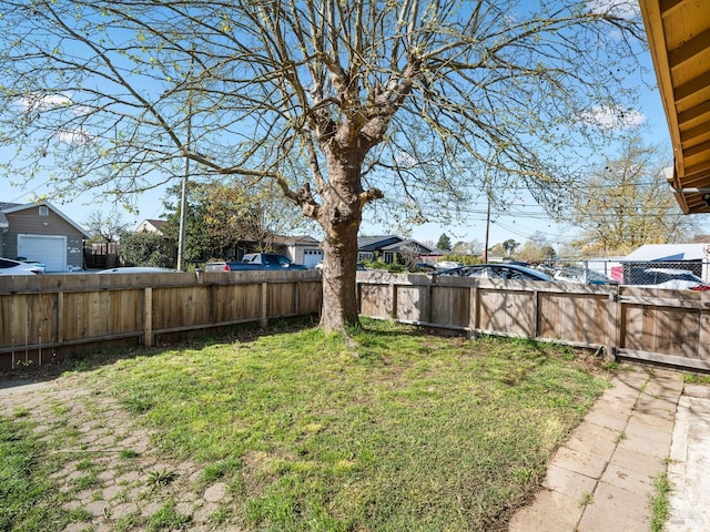 view of yard featuring a residential view and fence