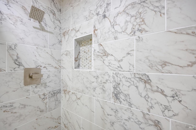 details featuring tiled shower