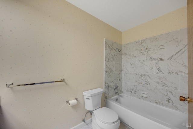 full bathroom with baseboards, toilet, and bathtub / shower combination