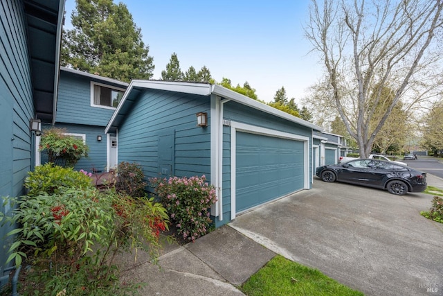 garage with concrete driveway