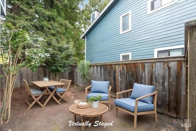 view of patio / terrace featuring a fenced backyard and outdoor dining area