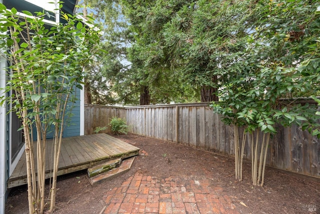 view of patio / terrace with a fenced backyard and a deck