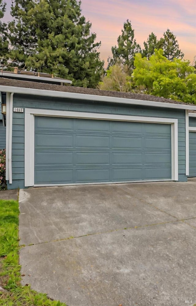 garage at dusk with a garage