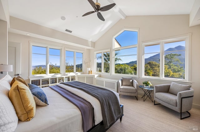 bedroom featuring ceiling fan, light carpet, visible vents, and vaulted ceiling with beams