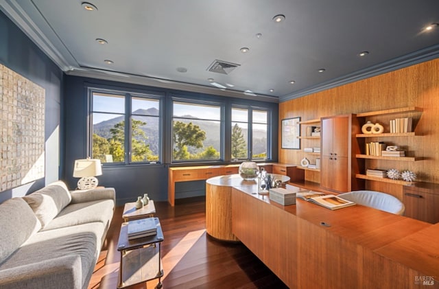 office space with crown molding, dark wood-style floors, and visible vents
