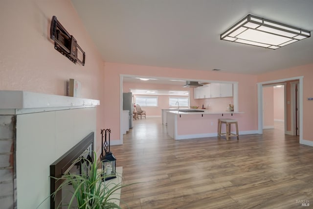 900 5th St, Fairfield, CA 94533 - living room with a glass covered fireplace, visible vents, baseboards, and wood finished floors