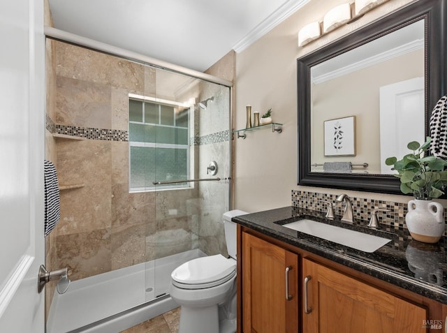 bathroom featuring toilet, tasteful backsplash, crown molding, and a stall shower