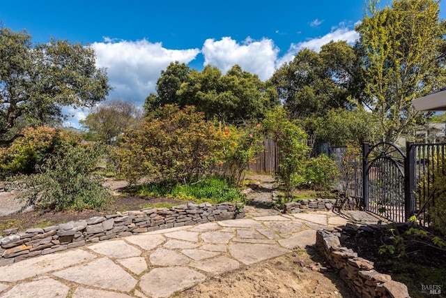 view of patio / terrace with a gate and fence