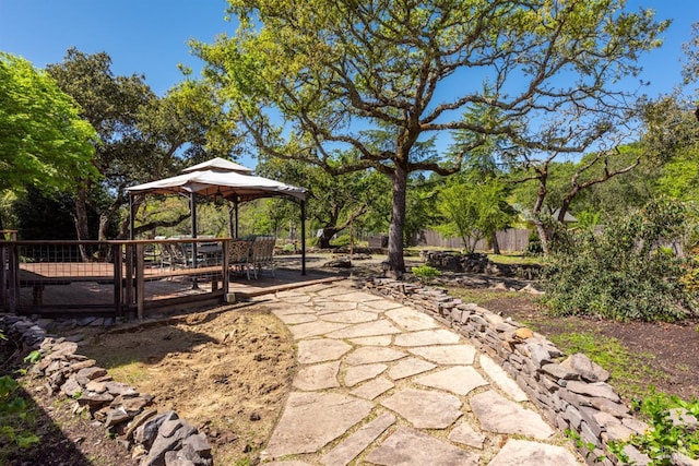 view of yard featuring fence and a gazebo