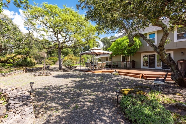 view of yard with a deck