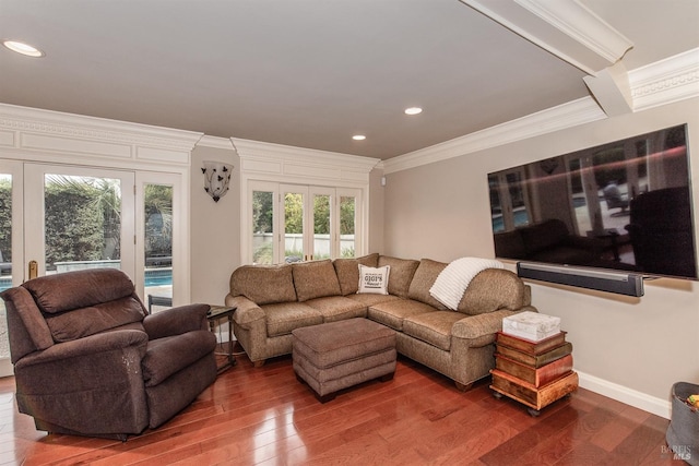 living room featuring baseboards, crown molding, wood finished floors, and recessed lighting