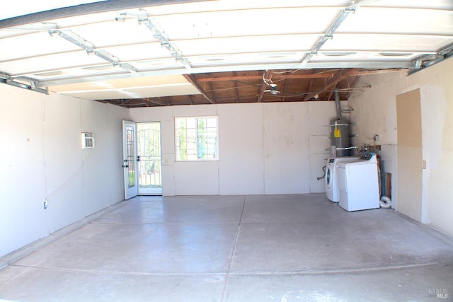 224 Walnut St, Suisun City, CA 94585 - garage featuring secured water heater, separate washer and dryer, and an AC wall unit