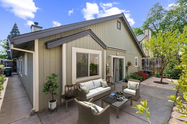 6705 Palmtree Ct, Fair Oaks, CA 95628 - rear view of house with an outdoor living space, a patio area, fence, and a chimney