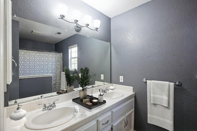 6705 Palmtree Ct, Fair Oaks, CA 95628 - full bath with visible vents, a sink, and a textured wall