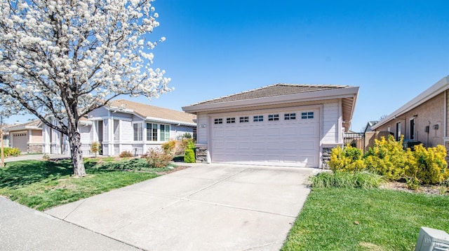 view of front of property with stone siding, a tiled roof, a garage, a front lawn, and an outbuilding