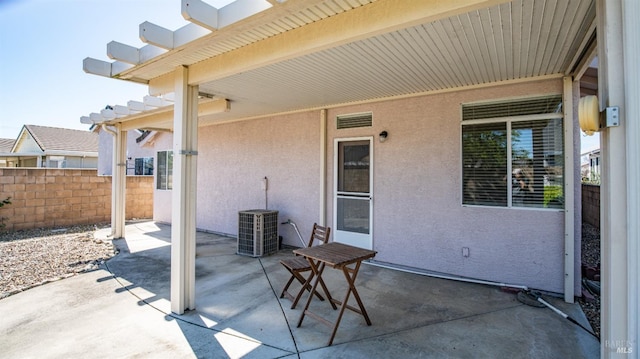 view of patio featuring fence
